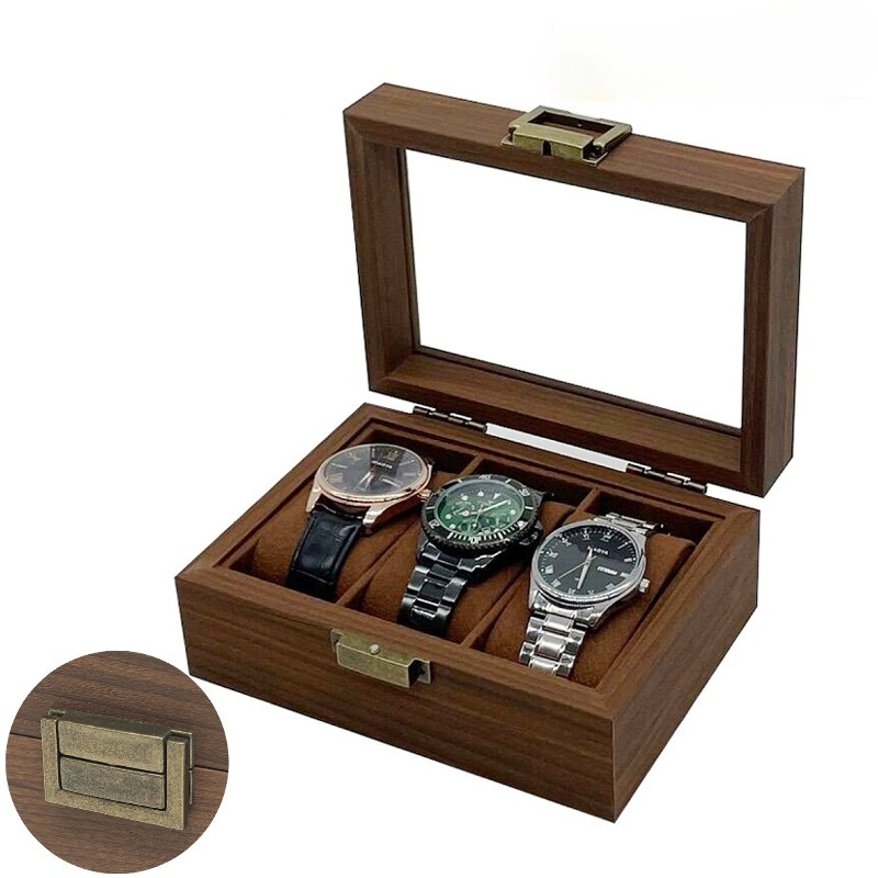 Open wooden watch box showing watch slots and glass lid