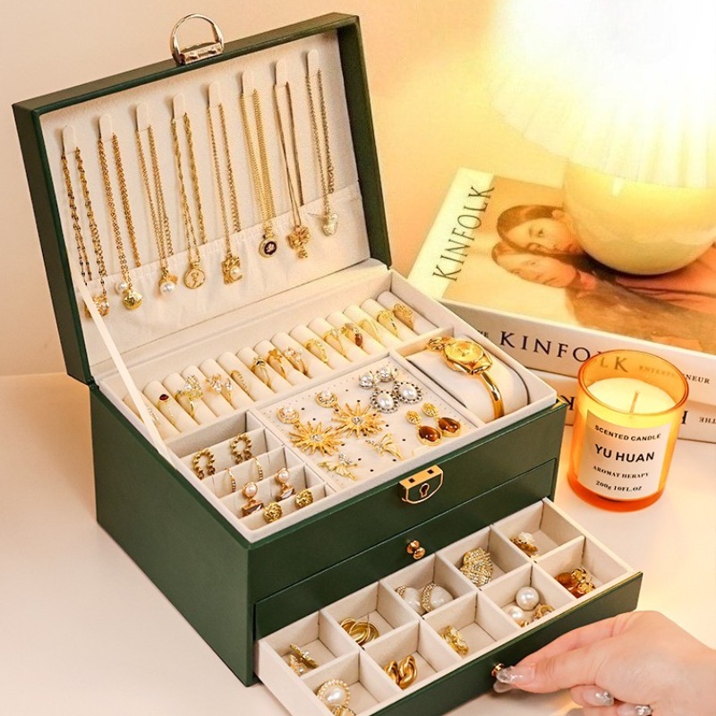 Two-layer and multi-layer jewelry boxes with lock, open to show necklace hooks and ring rolls